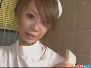 Sexy Asian nurse in tight white pantyhose playing with her w